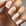 Close-up of a matte French manicure using shades from Paloma's Nude Collection, featuring soft nude tones as the base with crisp white French tips. This elegant and timeless design highlights the versatility of highly-pigmented, long-lasting nude gel polishes, perfect for a classic French manicure.
