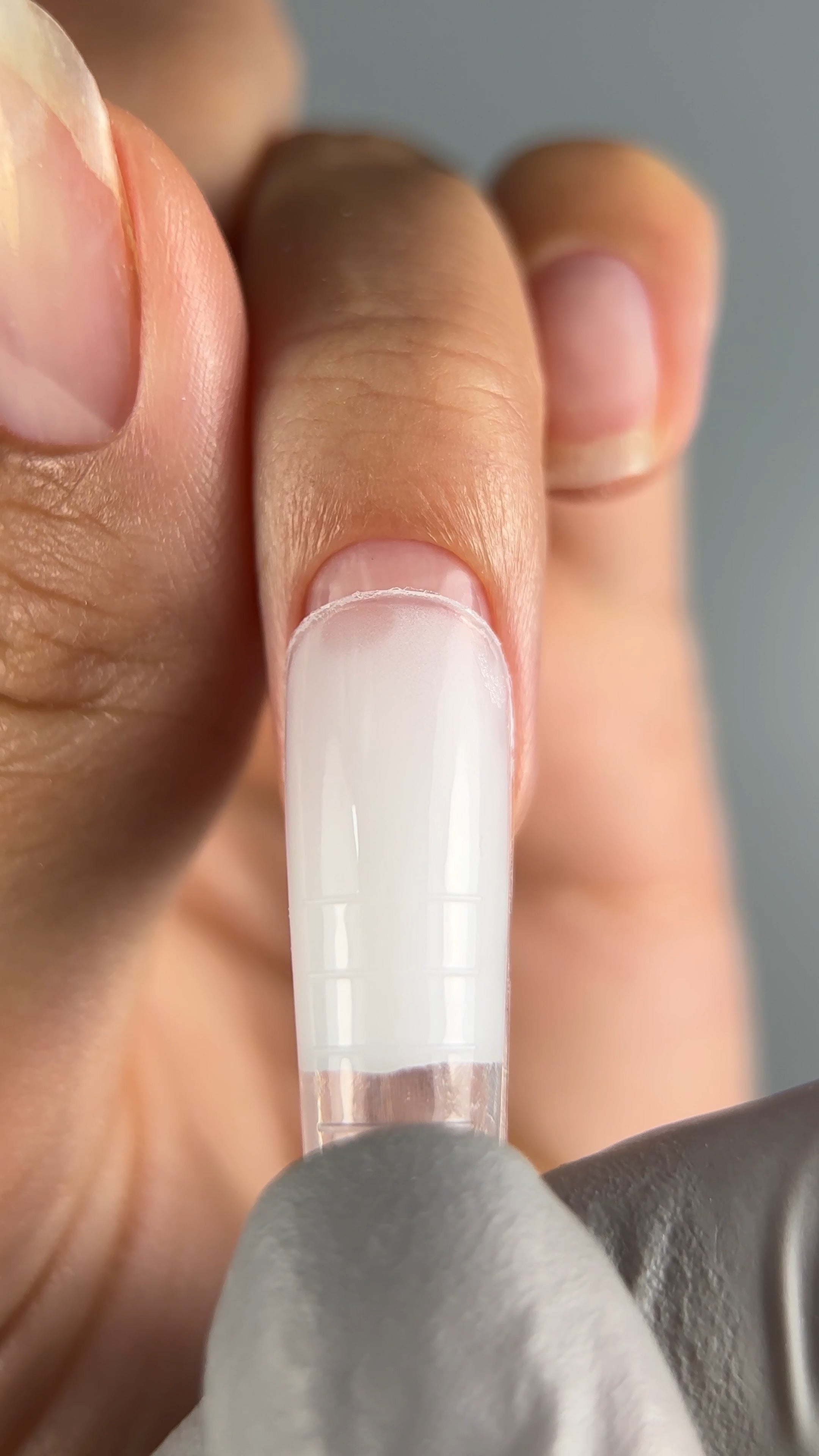 Step-by-step tutorial video on building square-shaped nail extensions using Paloma products and dual forms. This video demonstrates every stage, from cuticle trimming and nail prep with dehydrator and acid-free primer to applying clear rubber base, milky white P001 polygel, and finishing with Paloma Shine Top Coat for a glossy look. It also features Paloma's best-selling nail file and lint-free wipes for a clean finish. Perfect for achieving durable, professional-quality nail extensions.